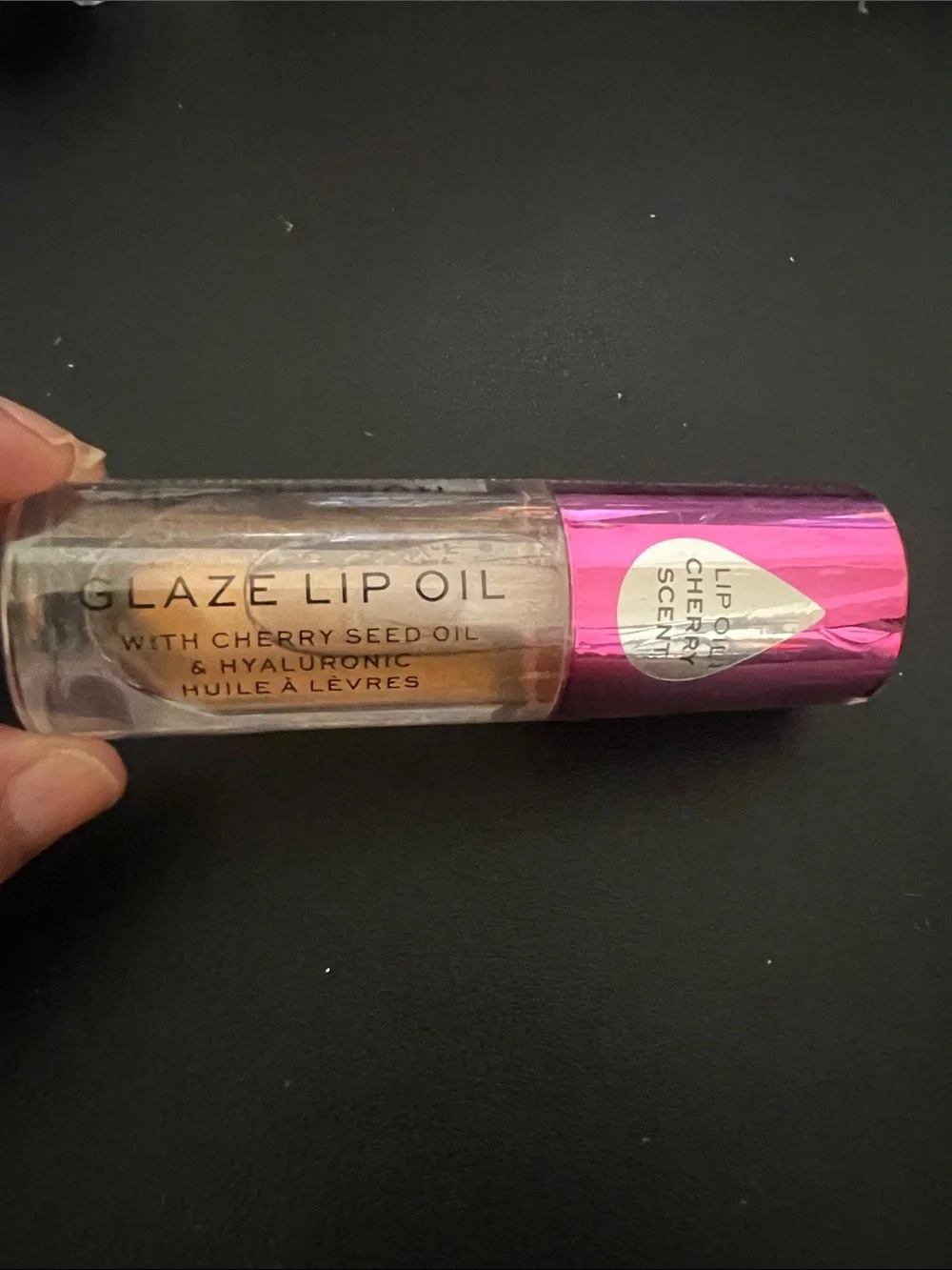 Revolution Metallic Gold Lip Oil with Pink Cap